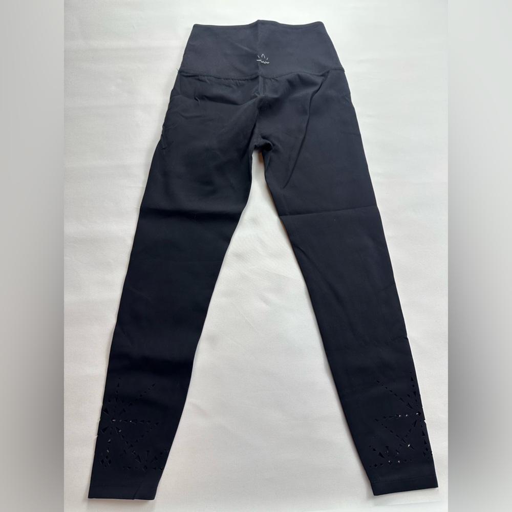 Beyond Yoga Limited Edition Black Leggings with cutouts on bottom of leg. Size S